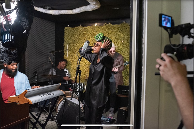 A band performing in a recording studio