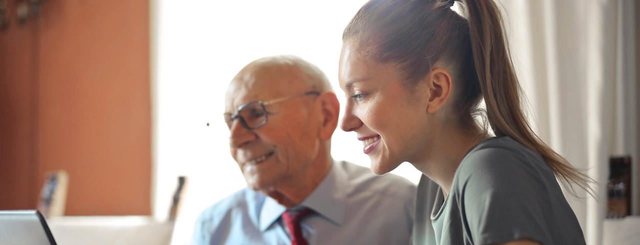 Business woman and her dad or uncle working at business.