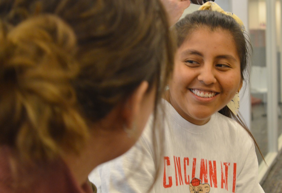 Closeup of Cielo Zabala over the shoulder of another woman