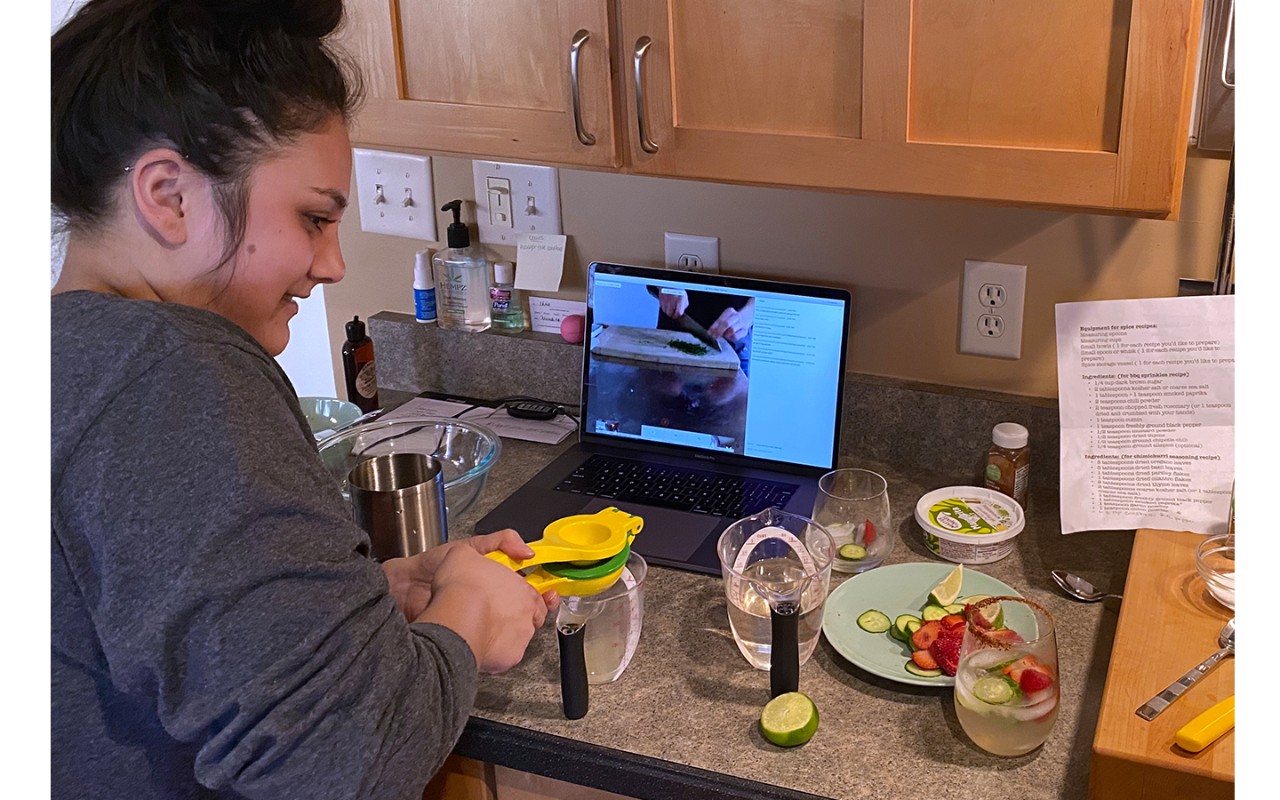 Student cooking along with online class