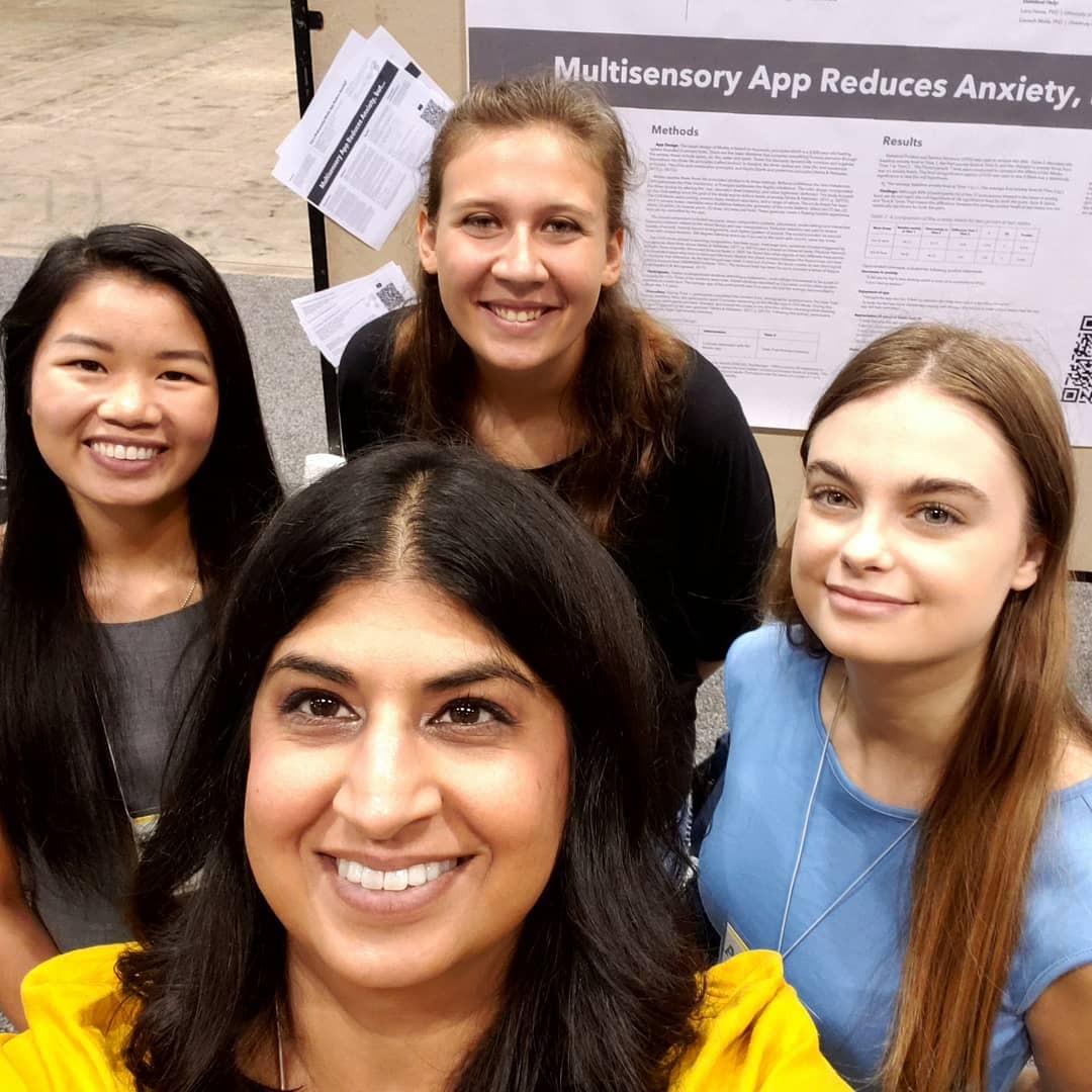professor and students pose for selfie