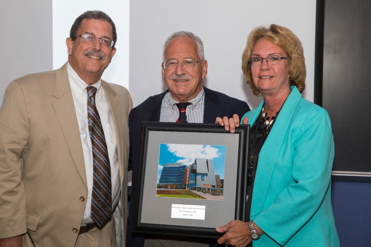 Form Dean Dr. William Ball, Dr. Peter Stambrook and Dr. Melanie Cushion standing together 