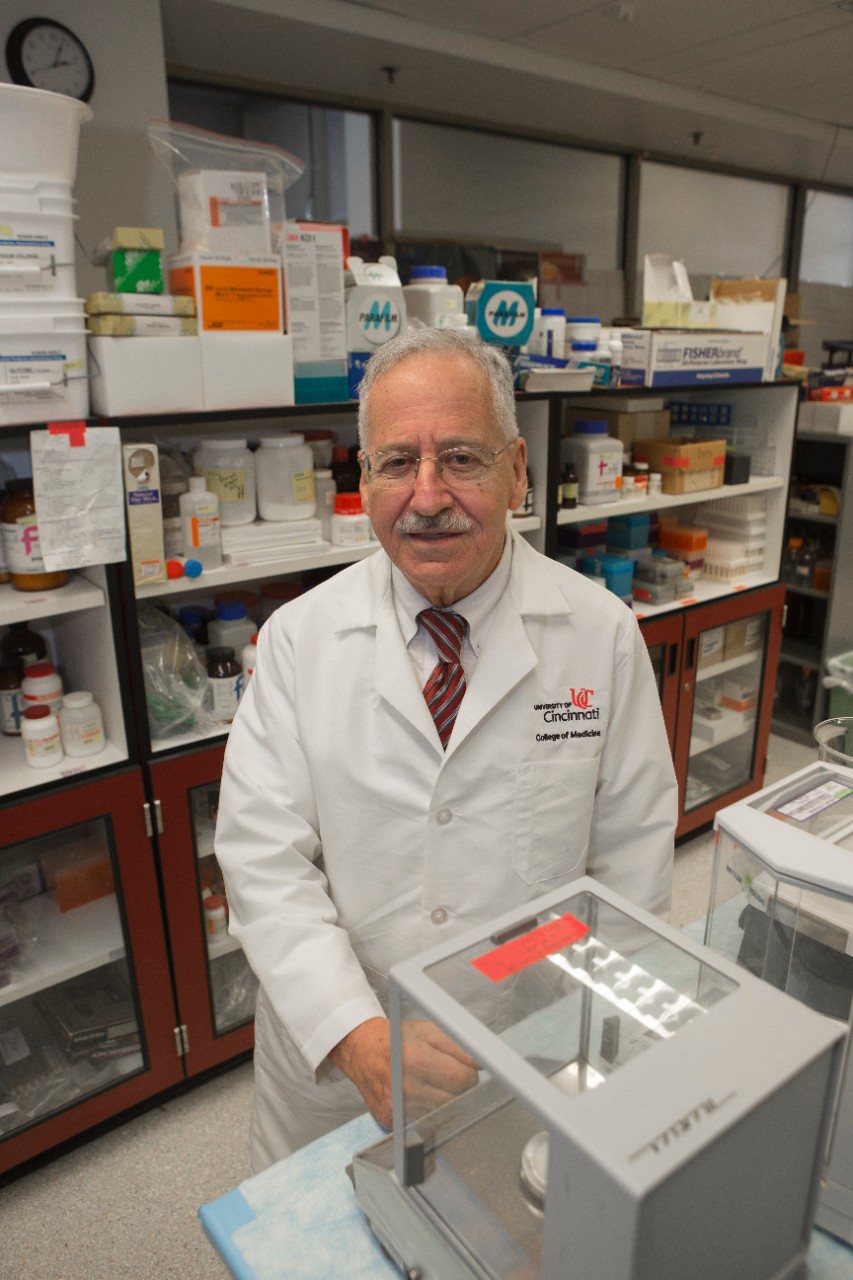 Peter Stambrook, PhD winner of the “Distinguished Research Professor Award” shown here in his lab and at Care/Crawley Building. UC/Joseph Fuqua II