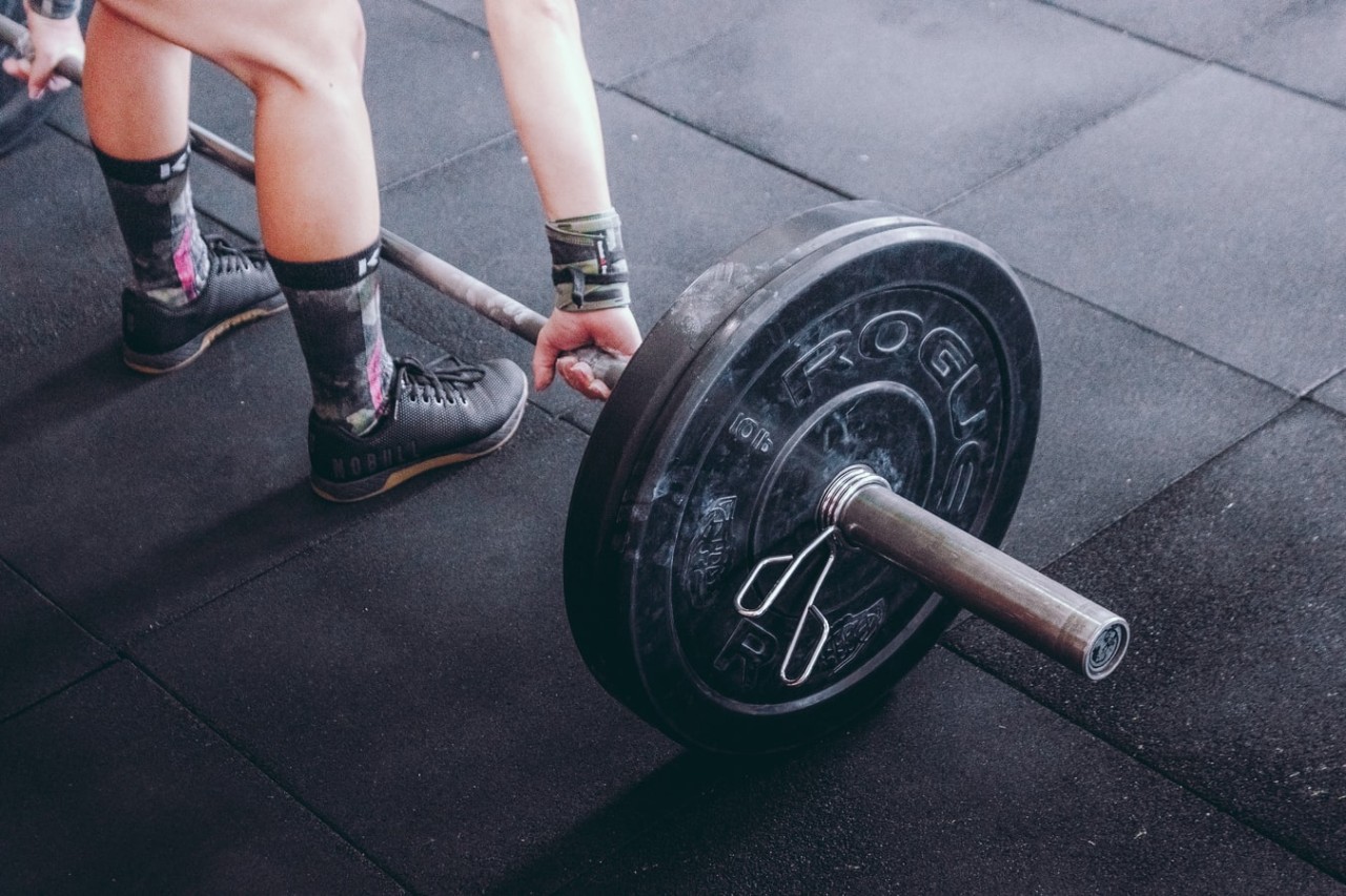 person lifting a weight