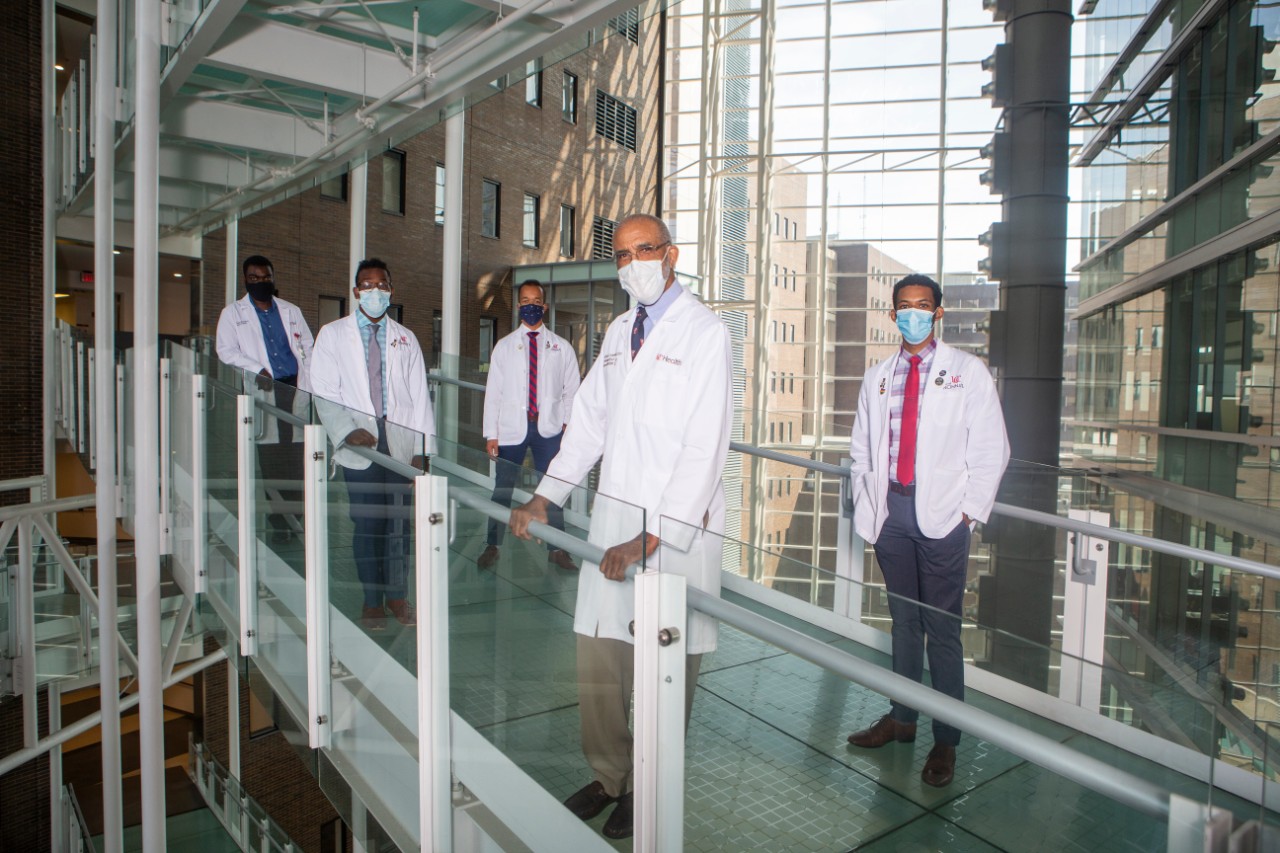 Dr. Alvin H. Crawford, middle shown here with mentors on 6th floor bridge at Care Crawley. UC/ Joseph Fuqua II. UC/Joseph Fuqua II