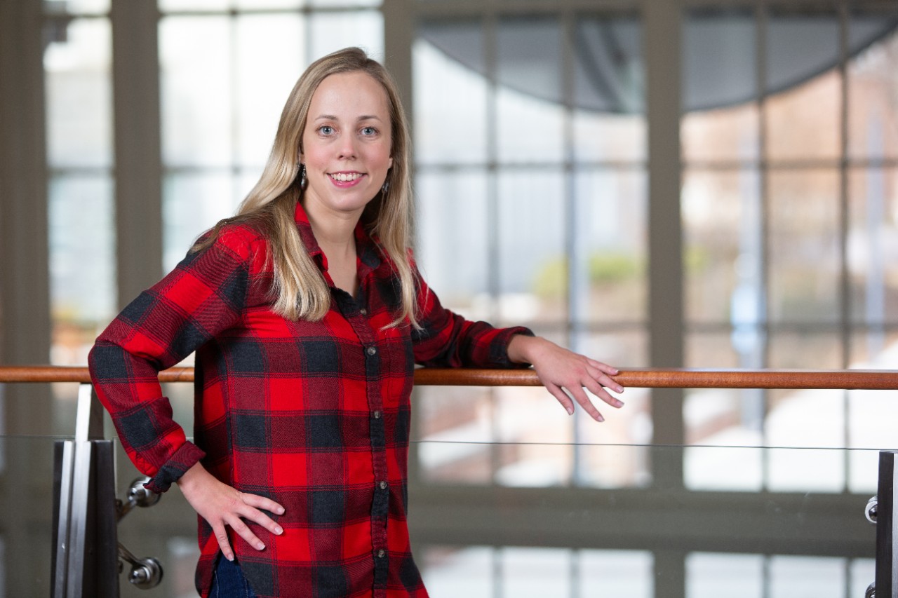 Woman in red and black shirt smiling