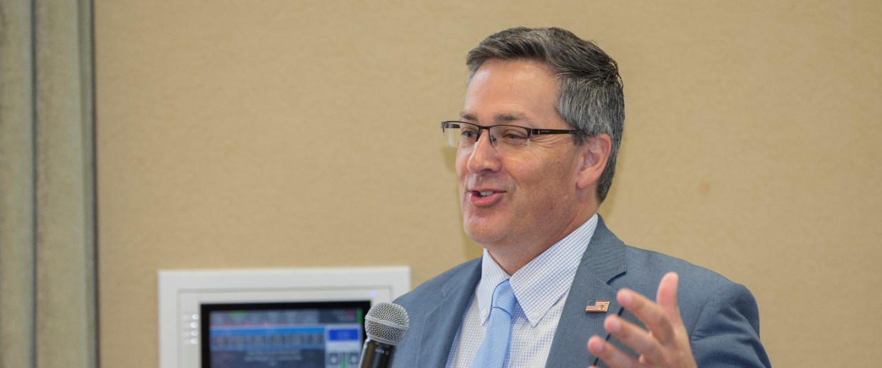 Richard Harknett at a podium speaking