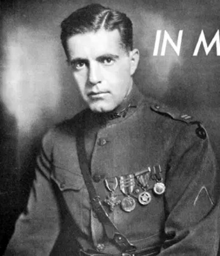 Black and white photo of a man in a military uniform