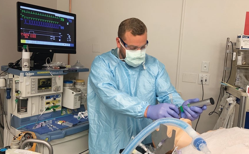 Student Adam Moellinger in the nurse anesthesia simulation lab