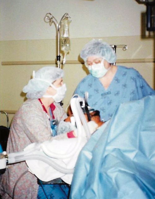 Eileen DePuy, CRNA, instructing a student on mask ventilation