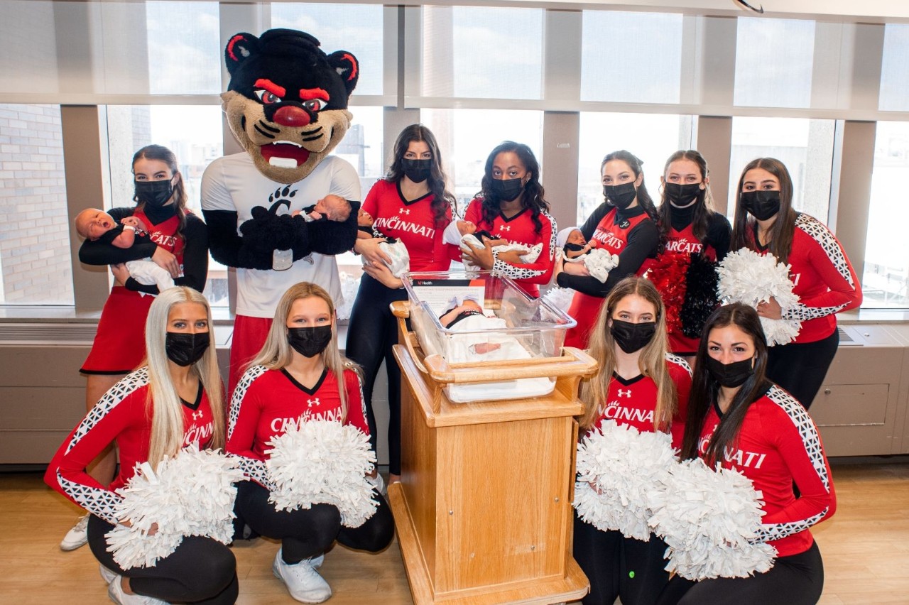 UC Bearcat mascot and members of the UC Cheer Team visit UC Medical Center to welcome the newest group of Baby Bearcats.  Photo courtesy of UC Health.