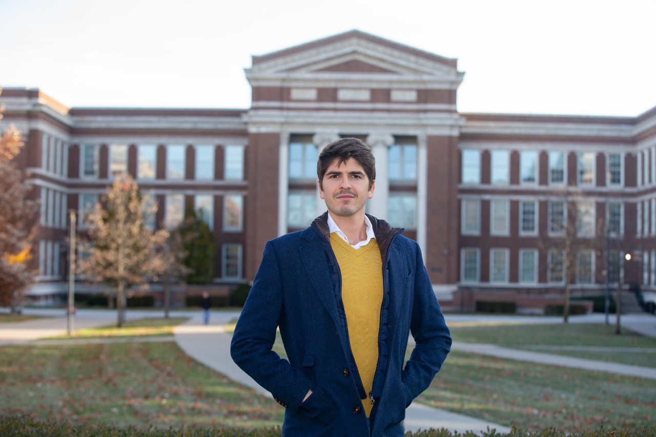 Javier Viaña stands in front of Baldwin Hall on UC's campus.