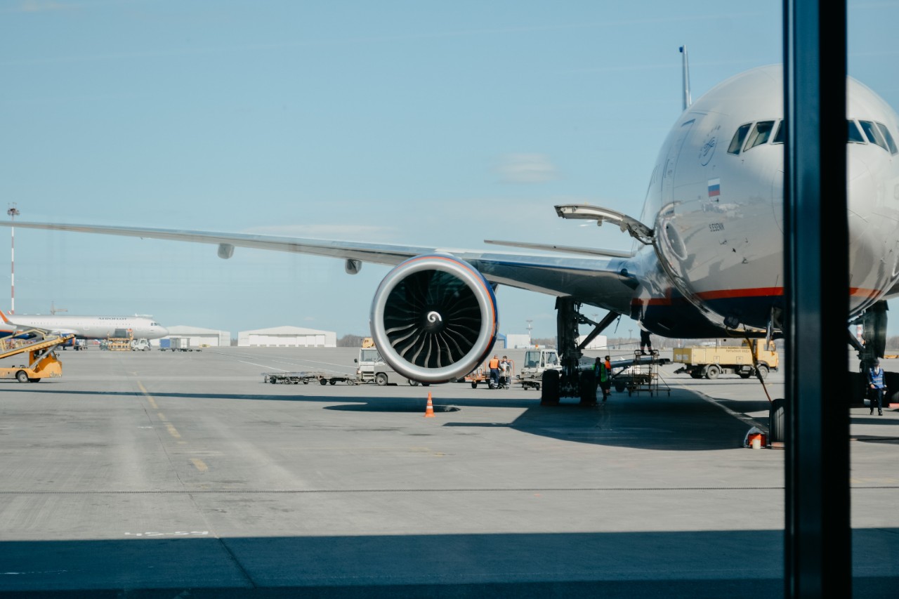 An airplane is seen outside a window.