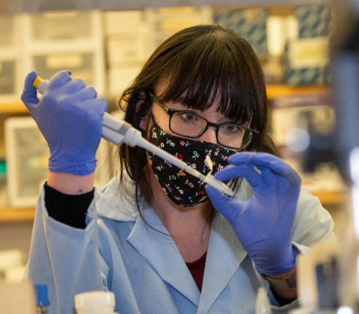 Students and researchers in chemistry and biology teamed up to unlock genetic secrets of female mosquitoes in three species that kill millions of people around the world each year. UC's findings hold promise to find the next generation of mosquito control. Dr. Joshua Benoit, post-doc Melissa Kelley, and student Melissa Uhran at work.