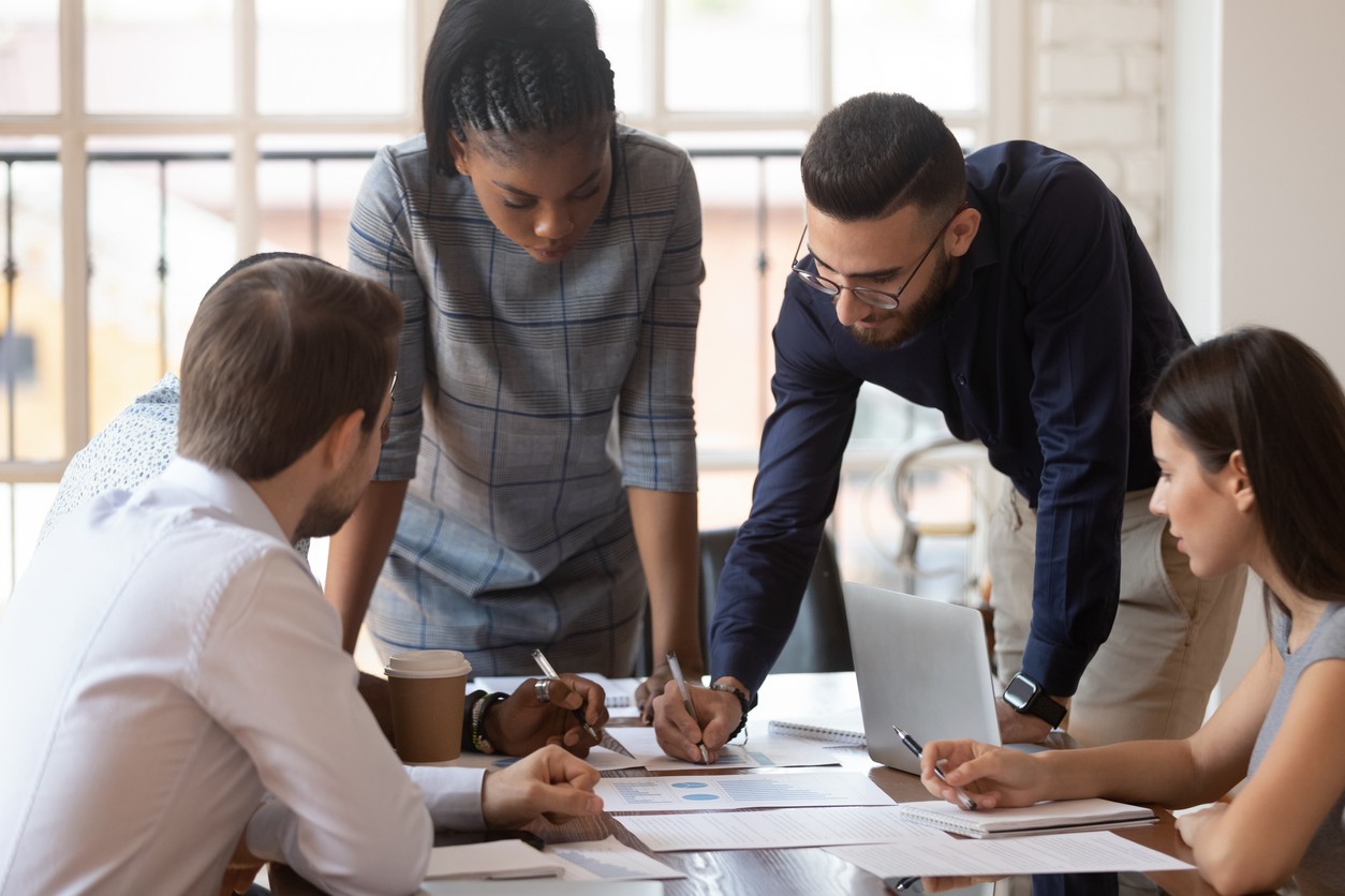 Diverse group of employees discussing project