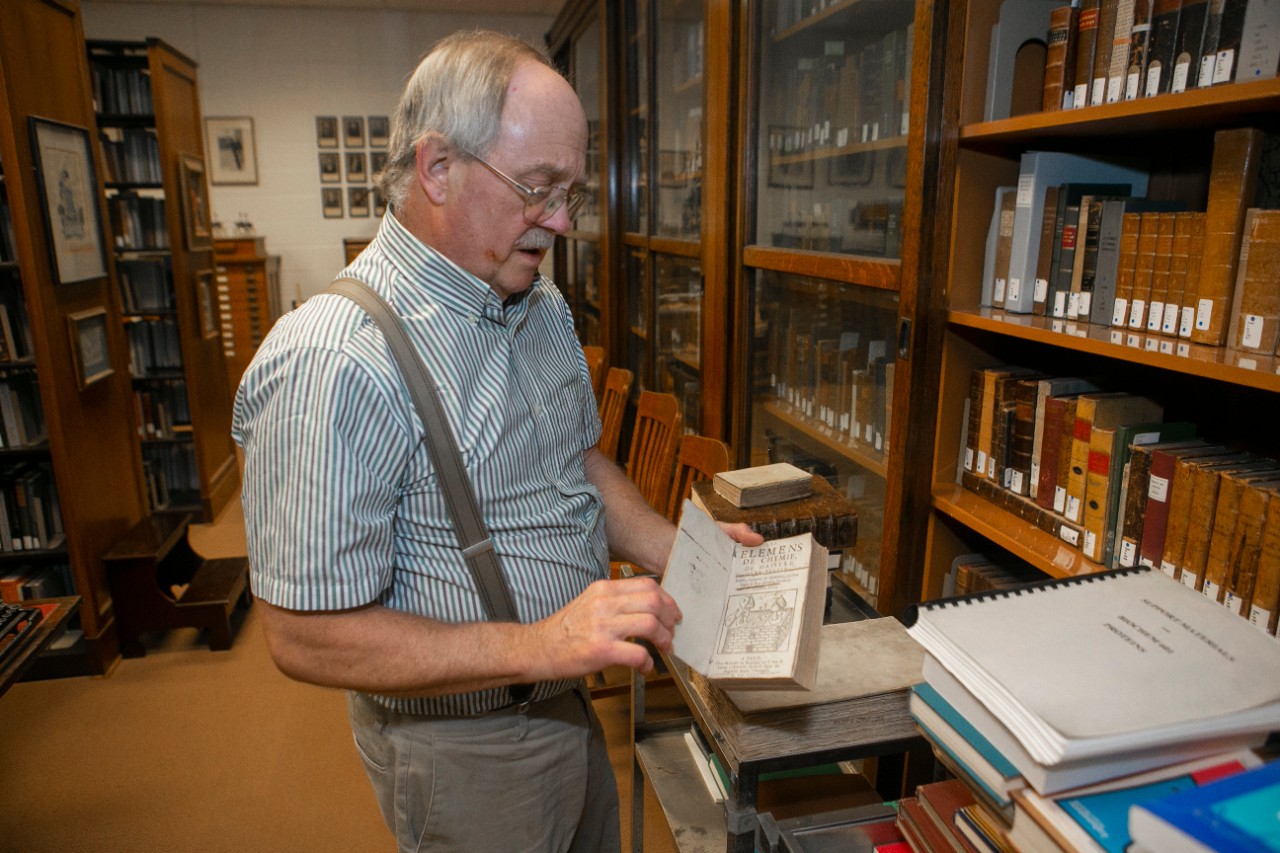 Rudy W. Thomas, MS shown here in the Chemistry Museum at Rieveschl. UC/Joseph Fuqua II