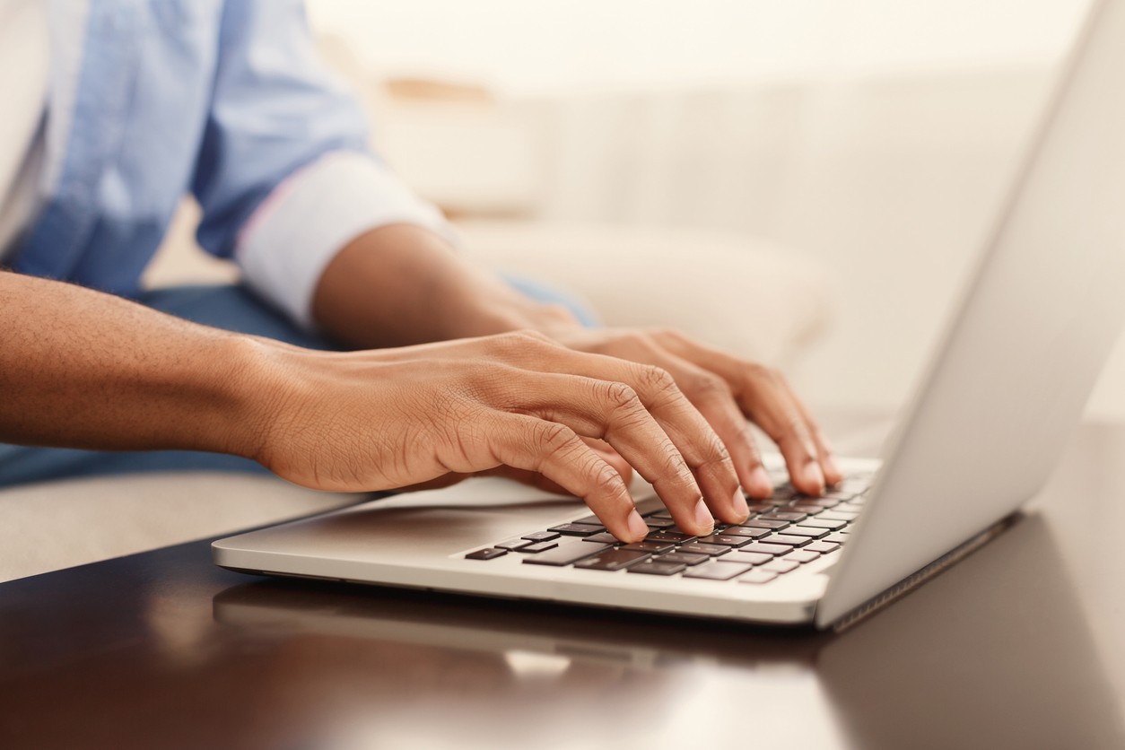 Person typing on laptop