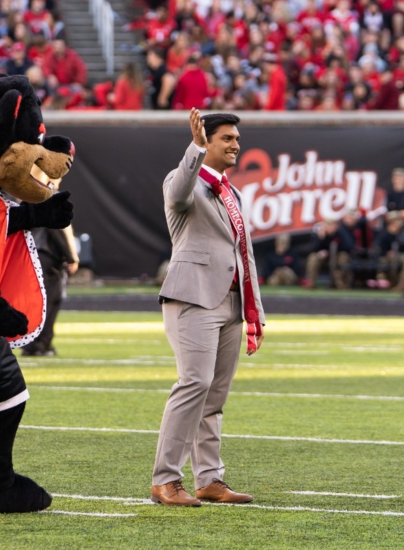 Rishi standing in Nippert Stadium during Homecoming