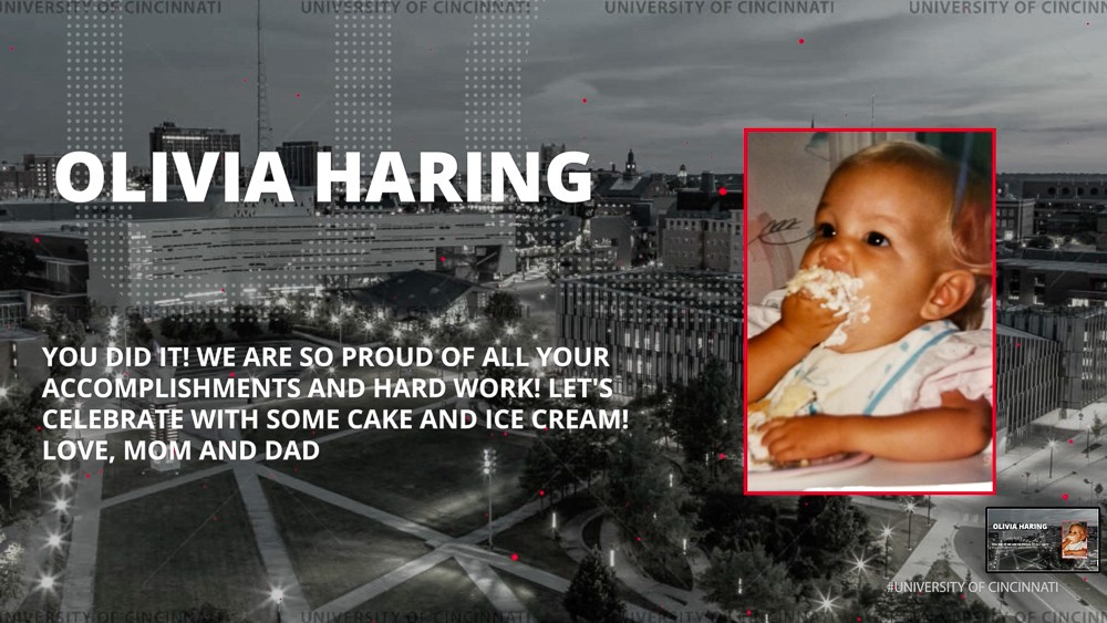 A photo of Olivia Haring overlays the UC campus with the message: You did it! We are so proud of all your accomplishments and hard work. Let's celebrate with some cake and ice cream. Love Mom and Dad.