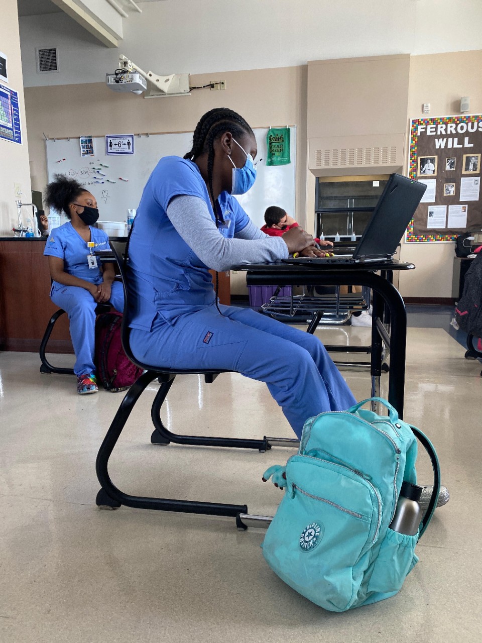 Benya Coleman shown in a classroom at Hughes STEM High School.