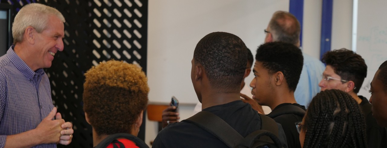 Dan Whitacre, senior director of Kroger Labs and Technology, has the attention of interested Hughes High School students.