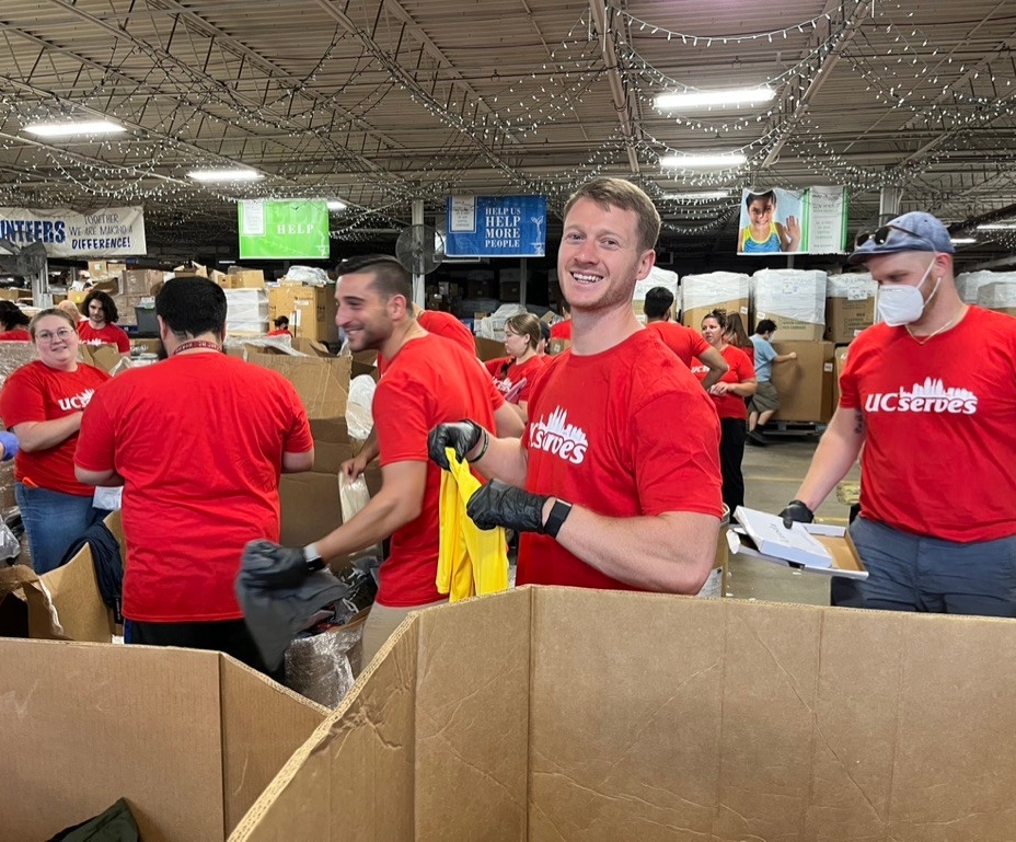 UC Online employees sorting clothing at Matthew 25: Ministries 