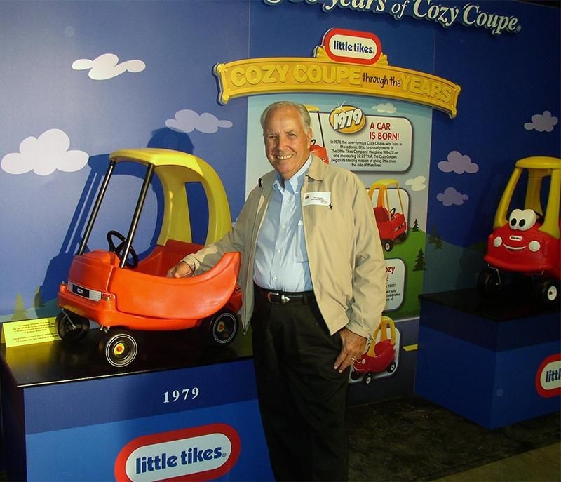 Jim Mariol stands next to a Cozy Coupe he designed for Little Tikes.