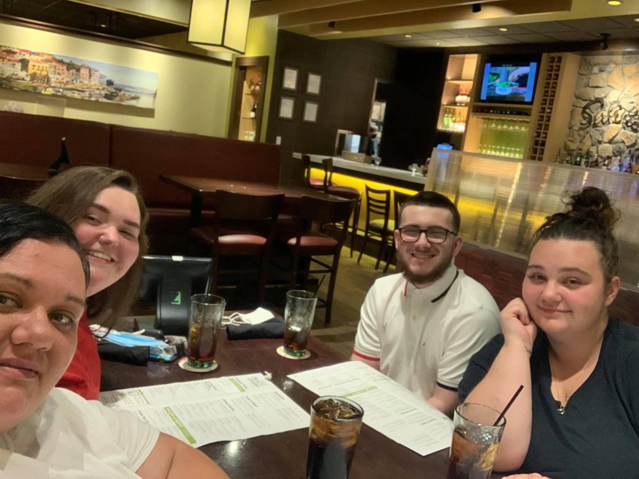 Marcus Elliott and family seated at a restaurant table