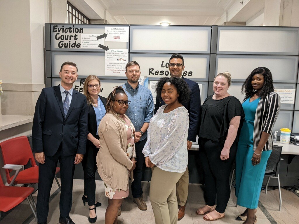 Eight staff and volunteers are shown at the Help Center for Hamilton County.