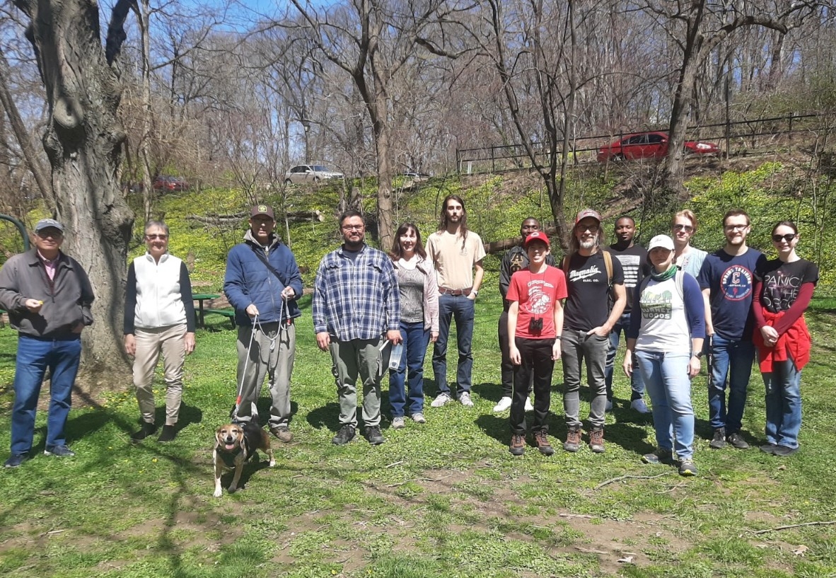 Denis Conover poses with a group of people on his nature walk.