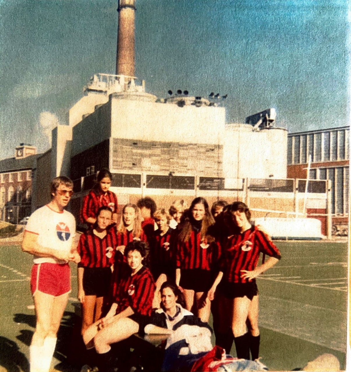 1970s photo of women's soccer team and coach