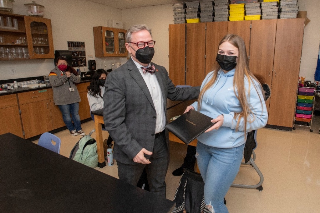 Jack Miner, Vice Provost for Enrollment Management surprised Brooke Bartholomew future UC Bearcats with Marian Spencer Scholarship award at Clark Montessori High School Tuesday February 1, 2022. Marian Spencer Scholarship award students with full tuition, room and board and an all-expenses-paid study abroad experience from the University of Cincinnati. Photos by Joseph Fuqua II