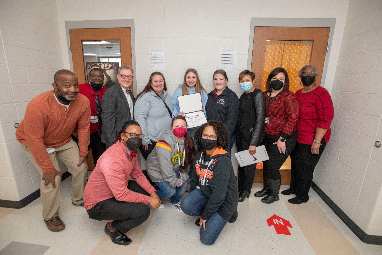 Jack Miner, Vice Provost for Enrollment Management surprised Brooke Bartholomew future UC Bearcats with Marian Spencer Scholarship award at Clark Montessori High School Tuesday February 1, 2022. Marian Spencer Scholarship award students with full tuition, room and board and an all-expenses-paid study abroad experience from the University of Cincinnati. Photos by Joseph Fuqua II