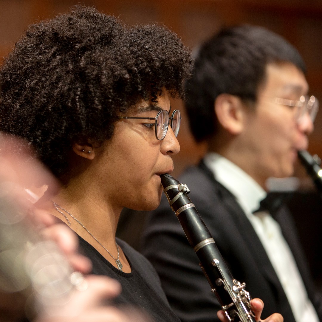 CCM Winds performs on stage.