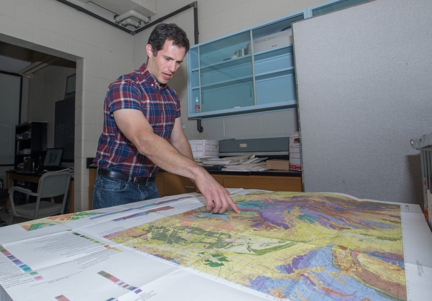 Daniel Sturmer, UC geology professor shown here in his at office and lab at Geo-Phys. UC/ Joseph Fuqua II
