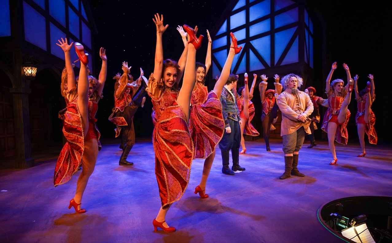 A group of students in Renaissance clothes dance in a dress rehearsal photo from CCM's Oct. 2022 production of "Something Rotten!" Photo/Mark Lyons