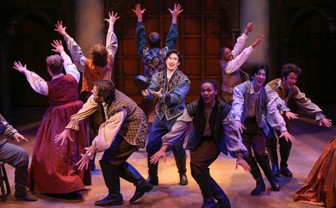 A group of students in Renaissance clothes dance in a dress rehearsal photo from CCM's Oct. 2022 production of "Something Rotten!" Photo/Mark Lyons