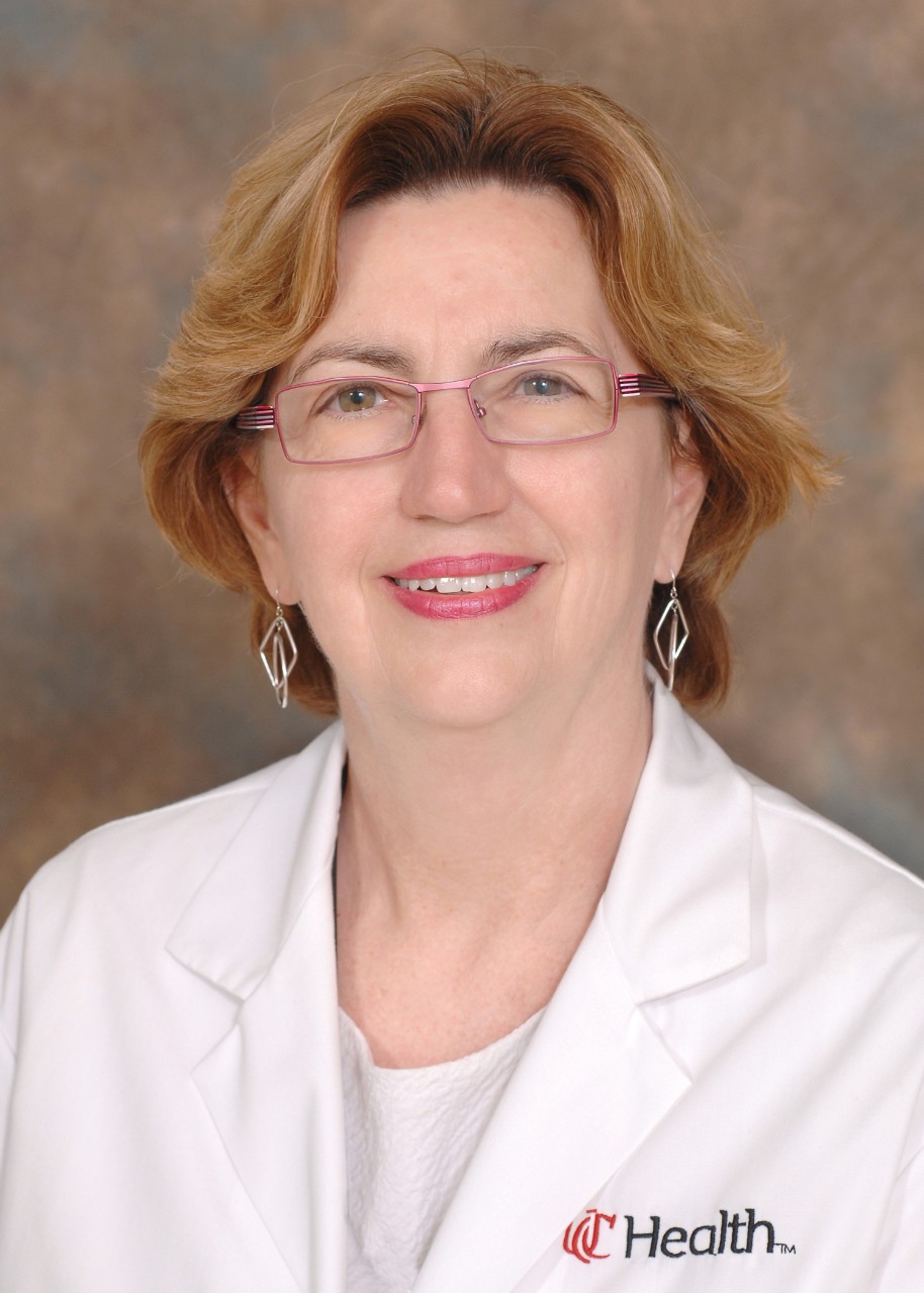 Head shot of a female doctor in a white lab coat