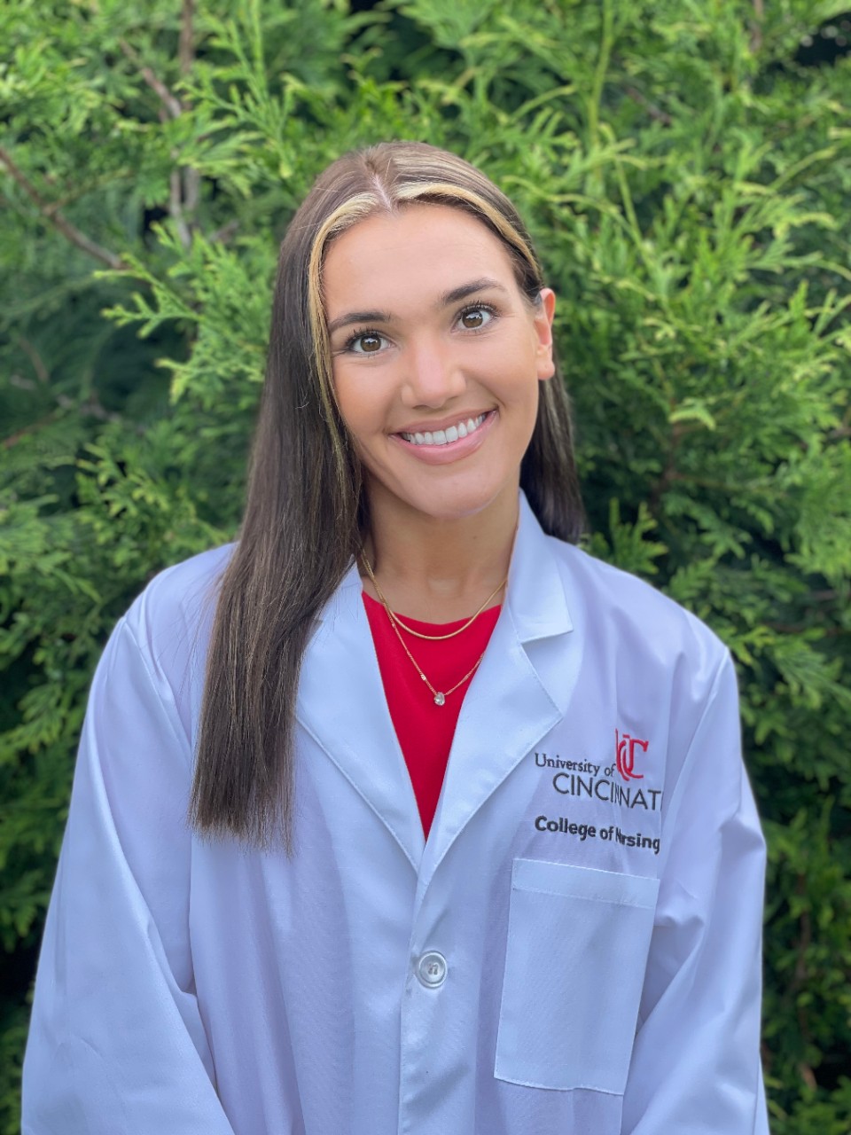 Emily Berning in white coat