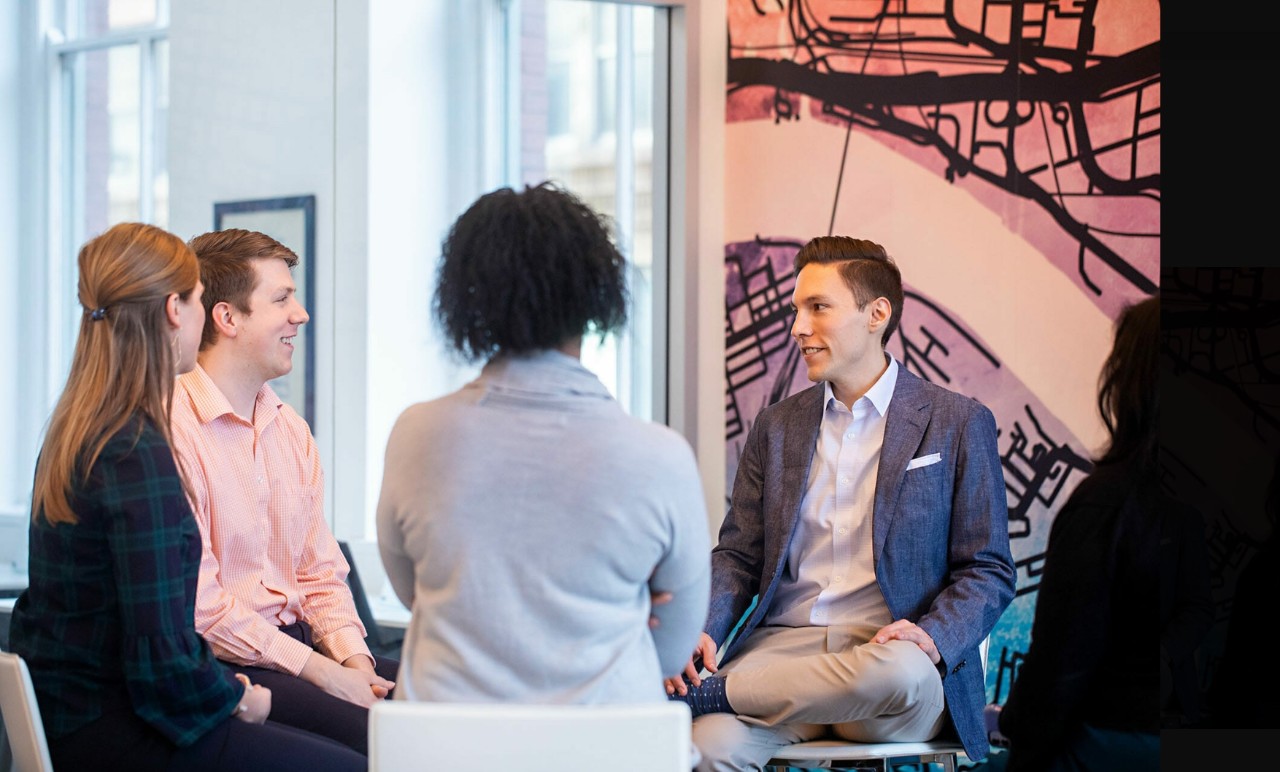 Mark Simon leading a discussion group with four attendees