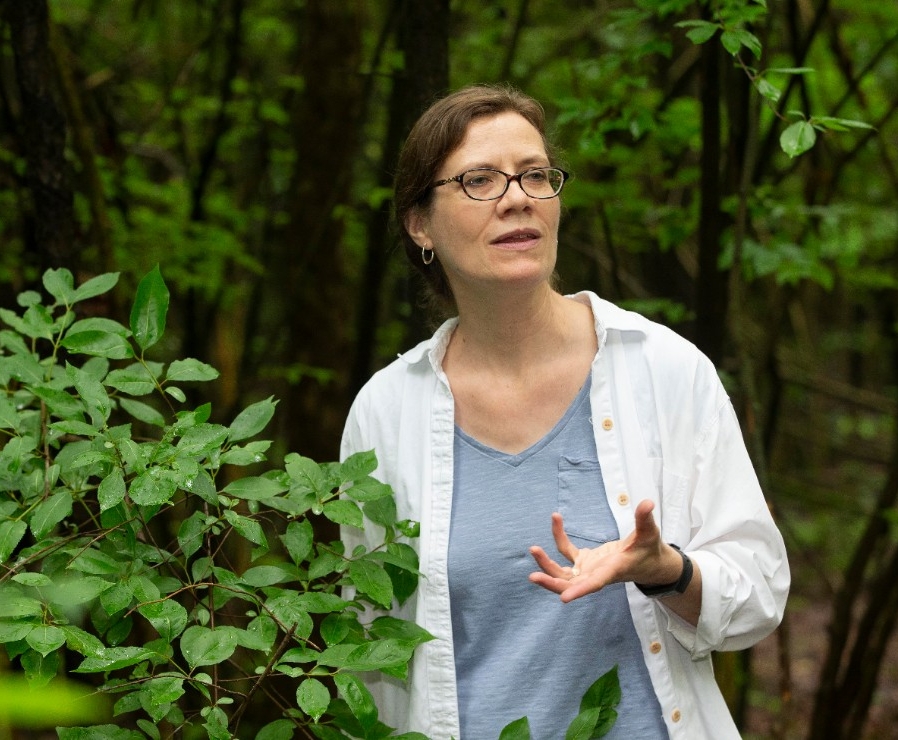 Theresa Culley, UC biology professor shown here with invasive Bradford or Callery pear trees at Harris benedict Nature Preserve in Hazelwood, Ohio.  UC/Joseph Fuqua II
