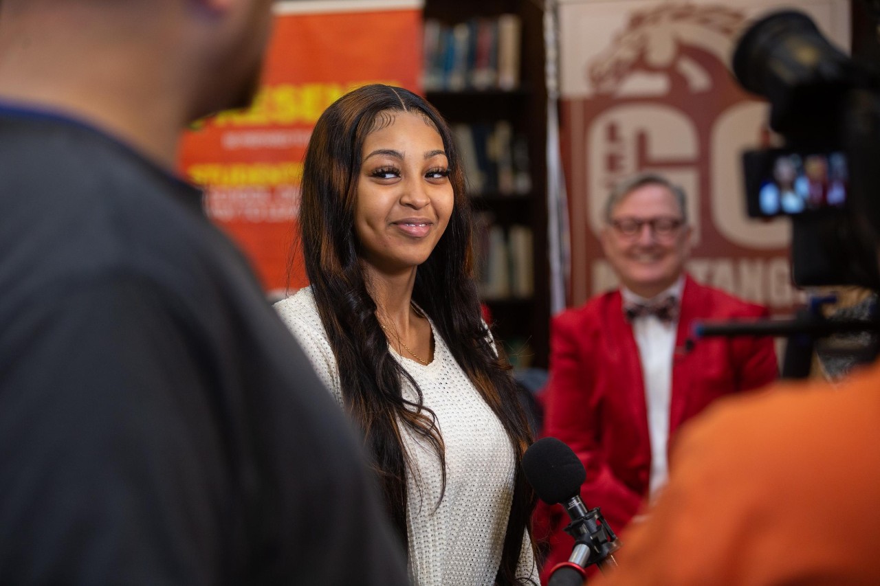 UC surprises Helen Dawit with her acceptance letter and Marian Spencer Scholarship on Decision Day.