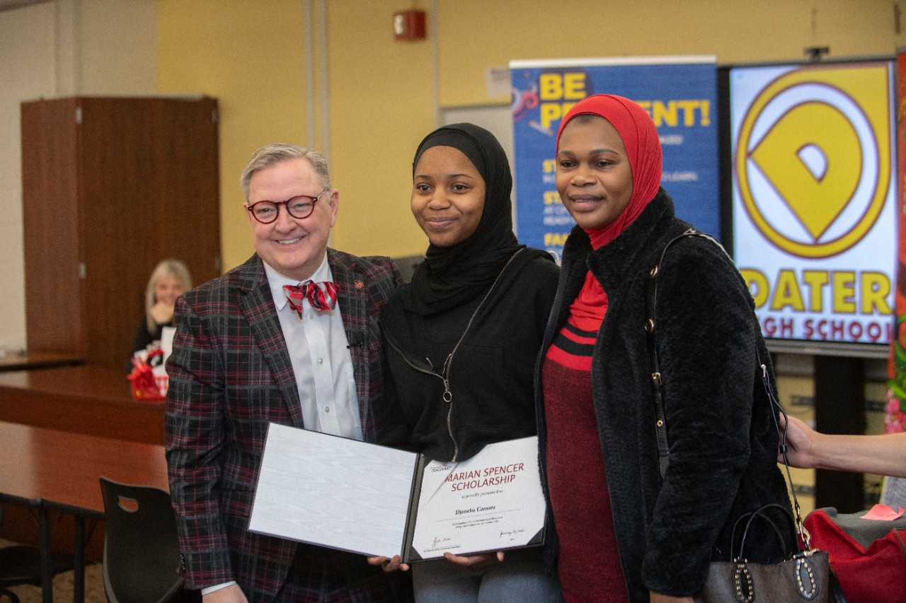 Jack Miner, Vice Provost for Enrollment Management surprised Djeneba Camara future UC Bearcats with Marian Spencer Scholarship awards at Dater High School Thursday January 26, 2023. Marian Spencer Scholarship  award students with full tuition, room and board and an all-expenses-paid study abroad experience from the University of Cincinnati. Photos by Joseph Fuqua II