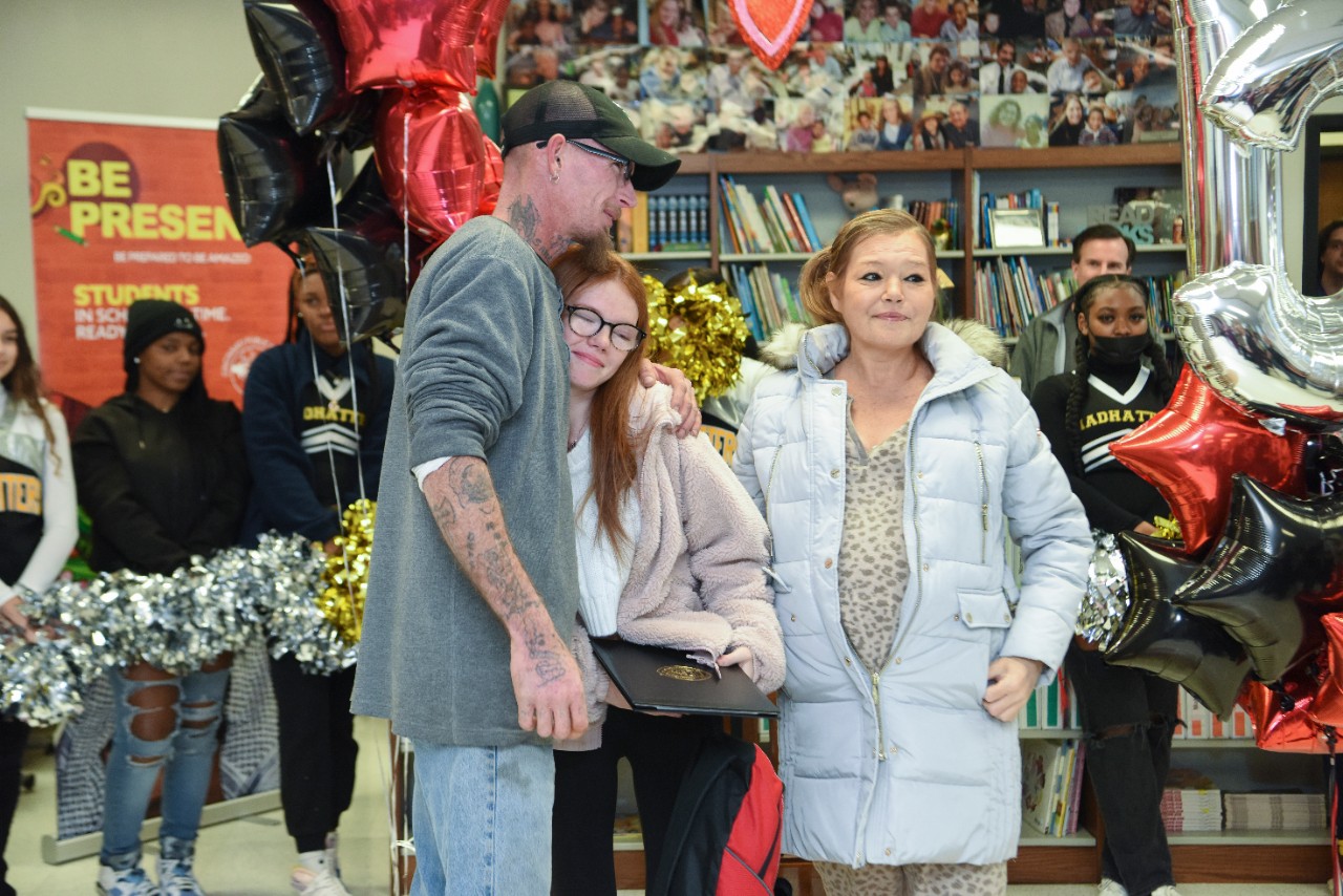 Jack Miner, Vice Provost for Enrollment Management surprised Sadie Smith future UC Bearcats with Marian Spencer Scholarship awards at Oyler High School Thursday January 26, 2023. Marian Spencer Scholarship  award students with full tuition, room and board and an all-expenses-paid study abroad experience from the University of Cincinnati. Photos by Joseph Fuqua II
