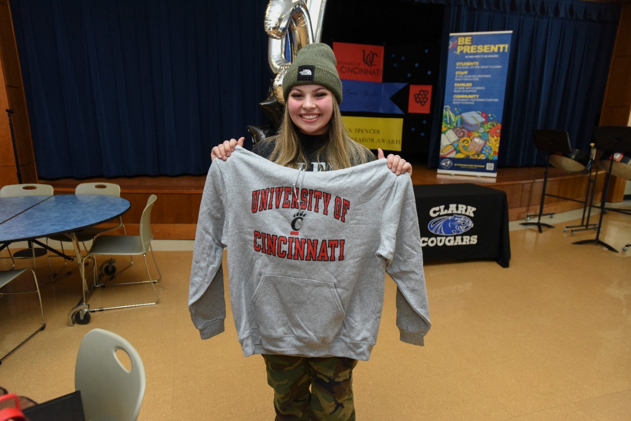 Jack Miner, Vice Provost for Enrollment Management surprised Amelia Tyson-Mueller future UC Bearcats with Marian Spencer Scholarship awards at Clark High School Tuesday January 31, 2023. Marian Spencer Scholarship  award students with full tuition, room and board and an all-expenses-paid study abroad experience from the University of Cincinnati. Photos by Joseph Fuqua II