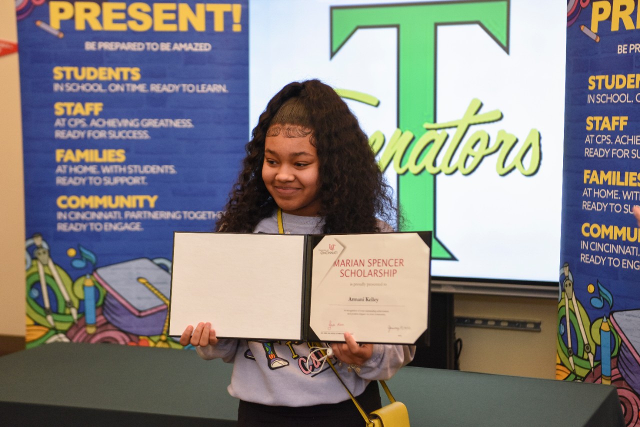 Jack Miner, Vice Provost for Enrollment Management surprised Armani Kelley future UC Bearcats with Marian Spencer Scholarship awards at Taft High School Thursday January 26, 2023. Marian Spencer Scholarship  award students with full tuition, room and board and an all-expenses-paid study abroad experience from the University of Cincinnati. Photos by Joseph Fuqua II