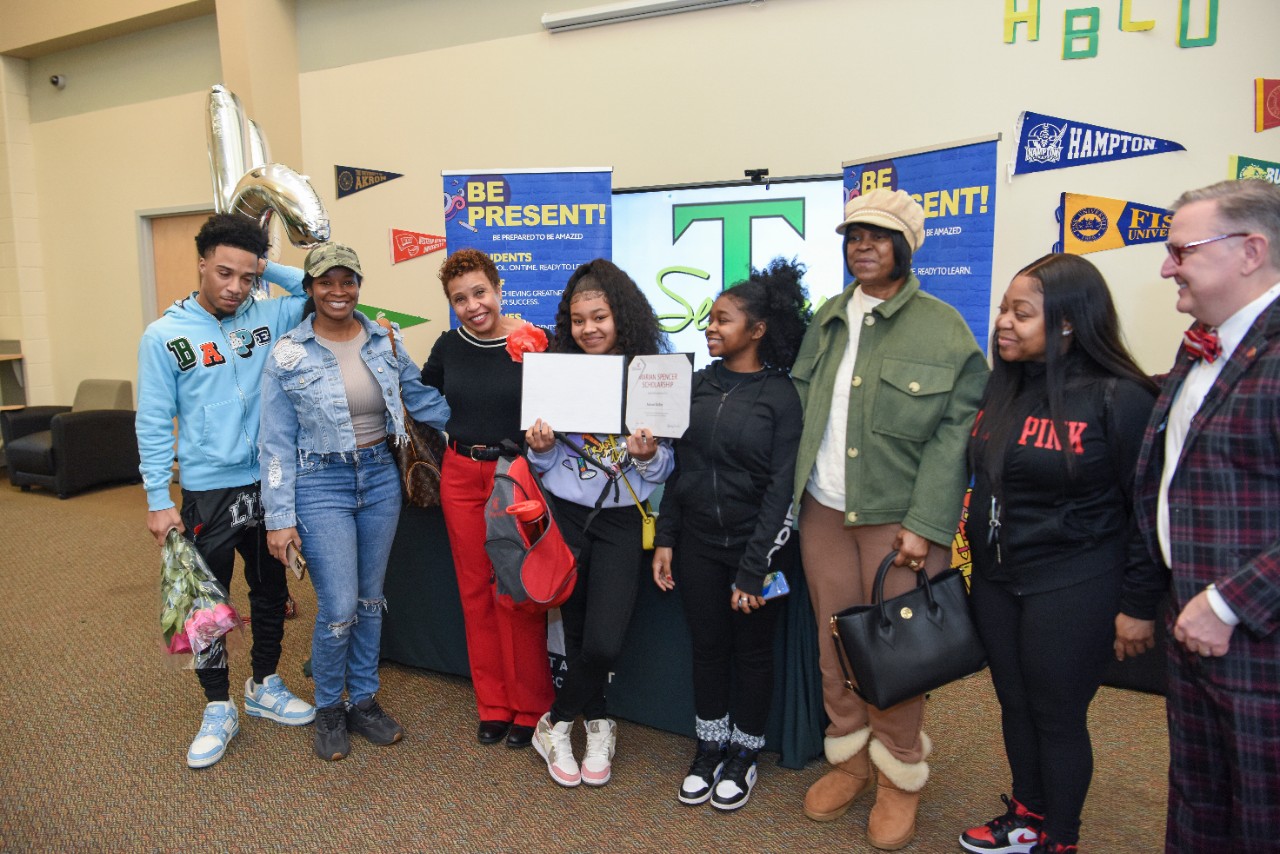 Jack Miner, Vice Provost for Enrollment Management surprised Armani Kelley future UC Bearcats with Marian Spencer Scholarship awards at Taft High School Thursday January 26, 2023. Marian Spencer Scholarship  award students with full tuition, room and board and an all-expenses-paid study abroad experience from the University of Cincinnati. Photos by Joseph Fuqua II