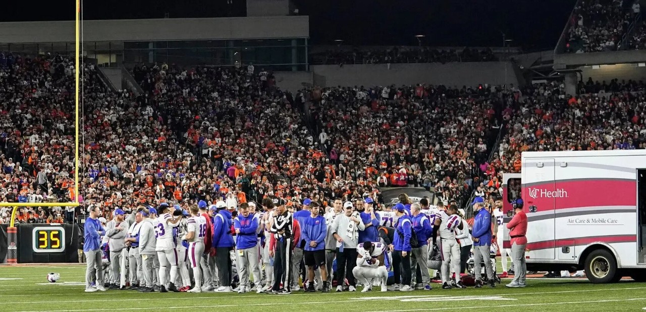 a photo of an ambulance on a football field responding to a medical emergency