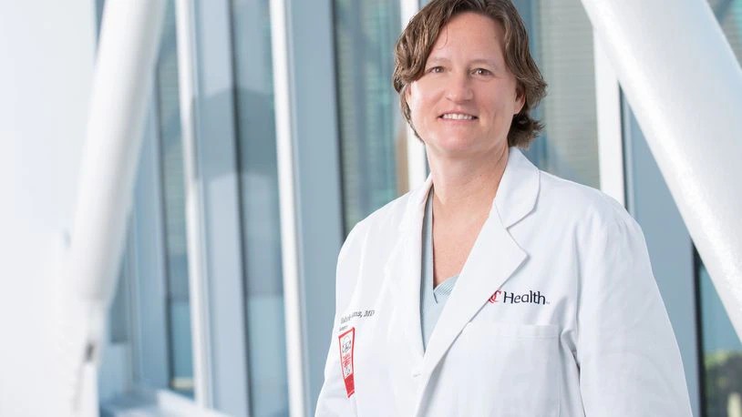 a woman doctor in a white lab coat in a medical building