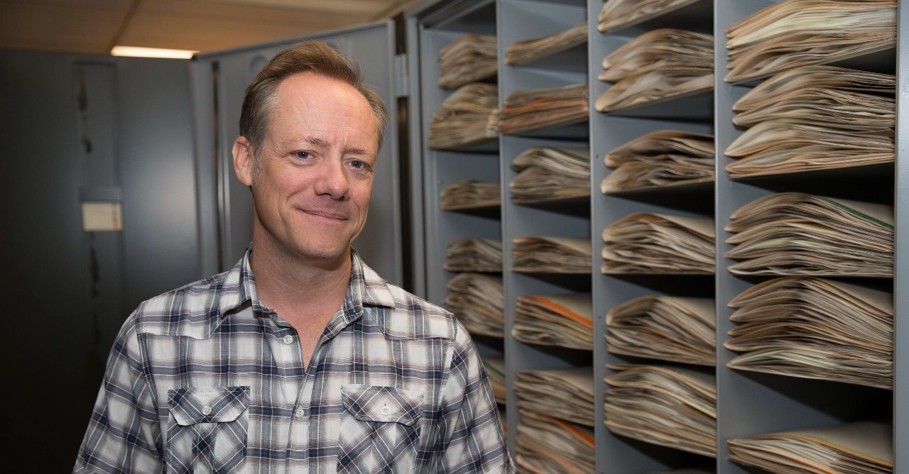 University of Cincinnati botanist Eric Tepe stands in front of cabinets full of specimens comprising UC's Margaret H. Fulford Herbarium.